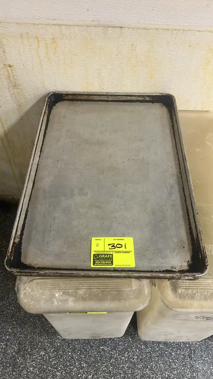 Metal full-size sheet pans. Features rolled rim construction. Ingredient bins underneath not included.