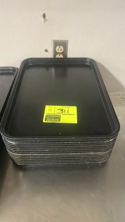 Black polymer display trays. Features raised rims and stackable construction. 18" x 12".