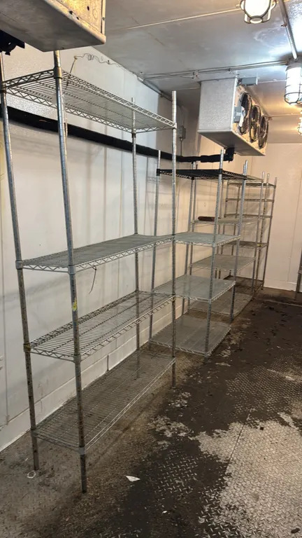 Metal multi-tier wire shelving units. Features adjustable wire shelves and tubular upright posts in assorted dimensions, including (3) 4-tier units an