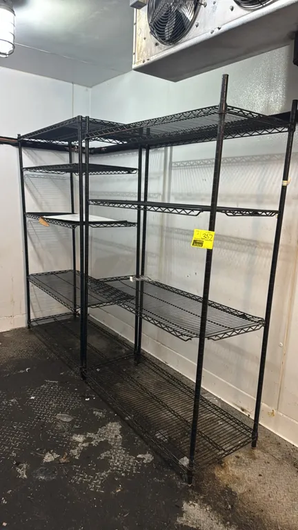 Coated multi-tier metal wire shelving racks. Features (4) tiers of adjustable wire shelving with black protective finish. Dimensions: 4'L each.