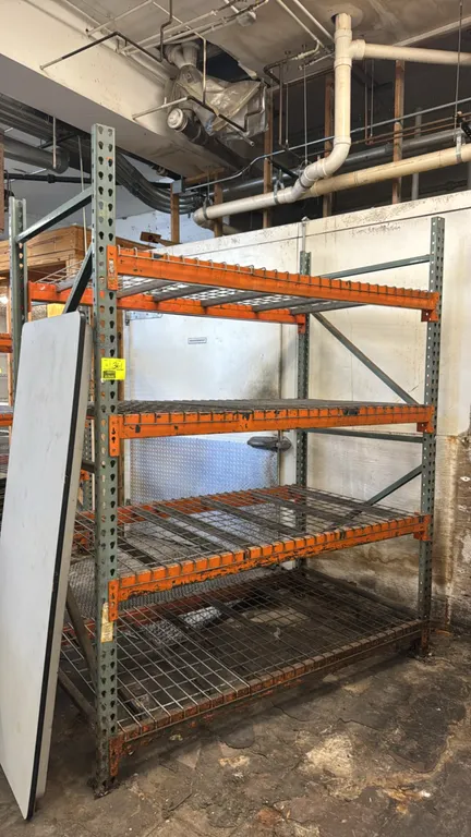 Interlake pallet racking sections. Features teardrop uprights, 4" crossbars, and wire metal decks. Dimensions: 6'L x 4'D x 8'H each. Surrounding equip