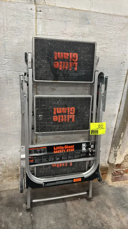 Little Giant Safety Step 3-step folding ladder. Features aluminum construction, folding safety handrail, slip-resistant treads, and 300 lb load capaci