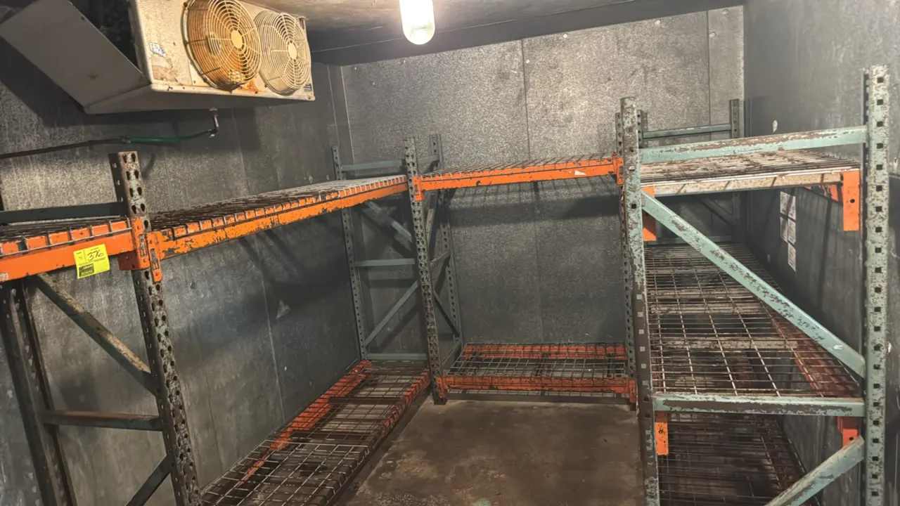 (1) 4'L, (1) 5'L, and (2) 8'L sections of Interlake pallet racking. Features 2'D x 6'H uprights, 4" crossbars, and wire metal decking. Evaporator in b