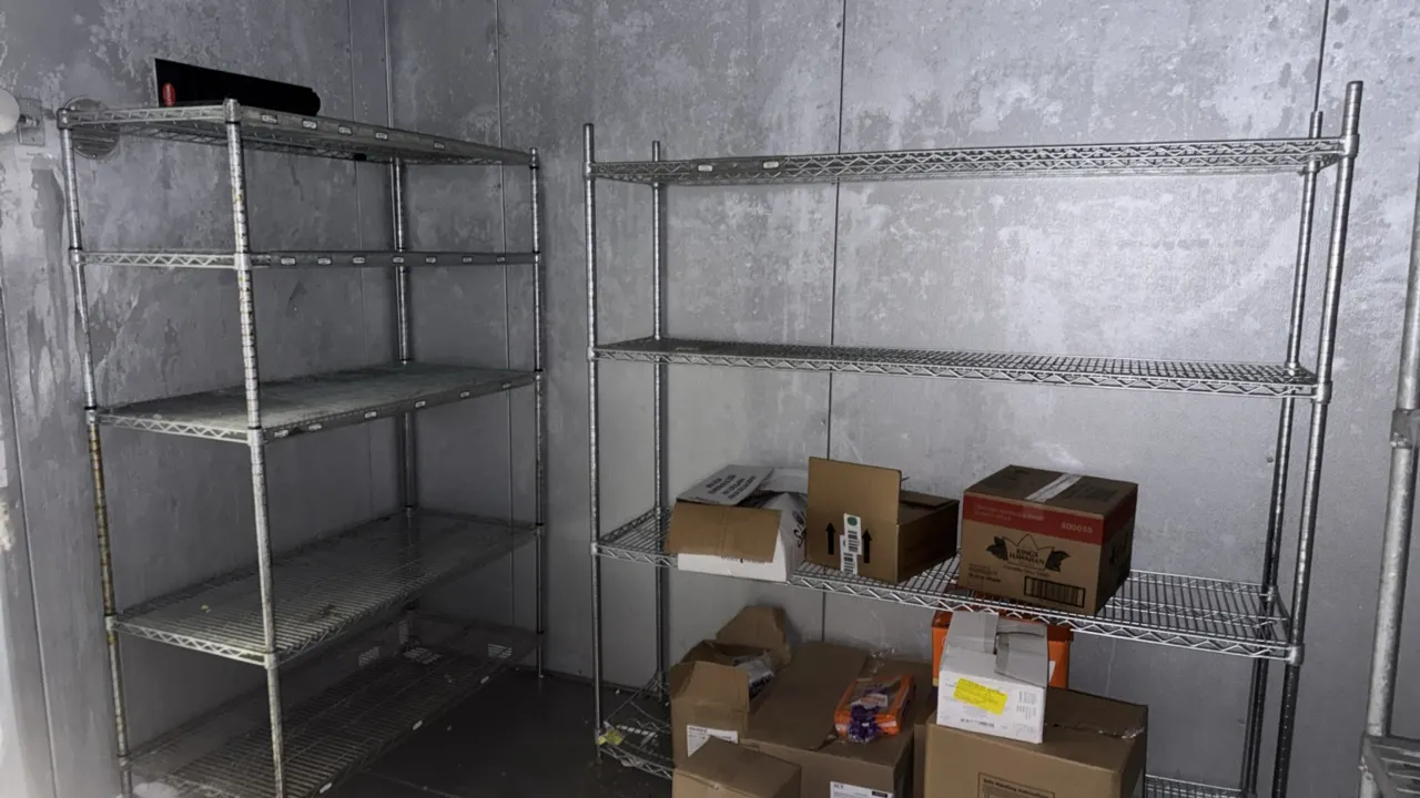 Chrome multi-tier wire shelving racks. Features adjustable wire shelves. Dimensions: 6' and 4' lengths. Contents not included.