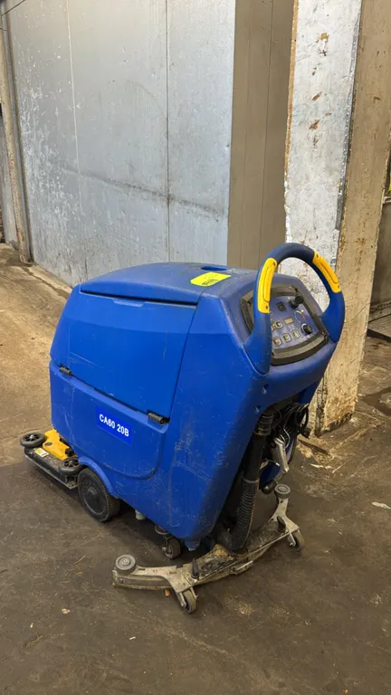 Clarke CA60 20B walk-behind floor scrubber dryer. Features curved rear squeegee assembly, scrub deck, digital control panel with key, and recovery dra