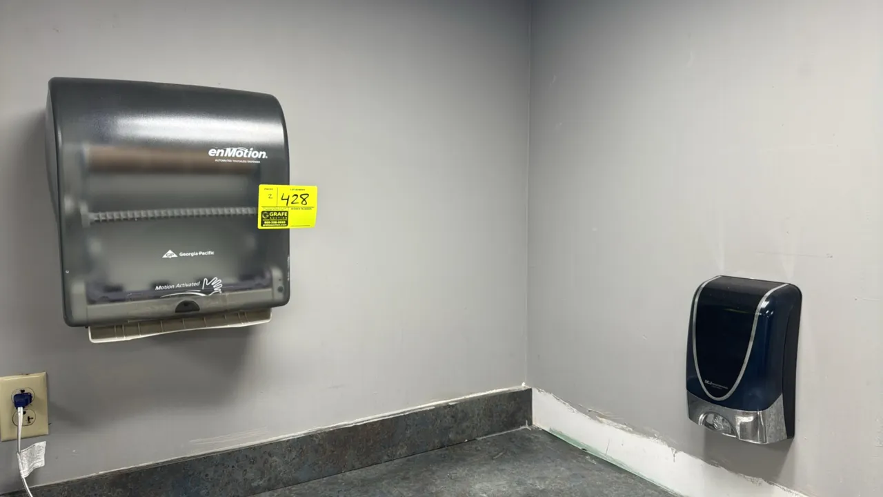 Georgia-Pacific enMotion touchless paper towel dispenser and SC Johnson Professional touchless soap dispenser. Features wall-mounted construction and