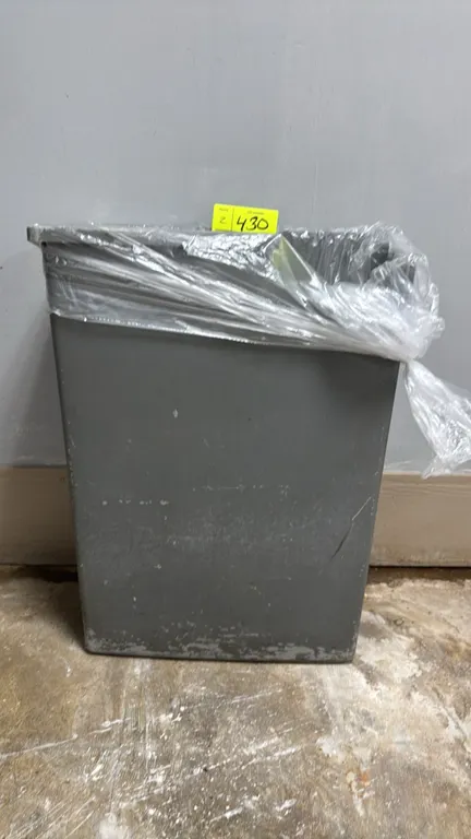 Poly trash cans. Molded plastic construction with rectangular open-top design. Finished in gray.