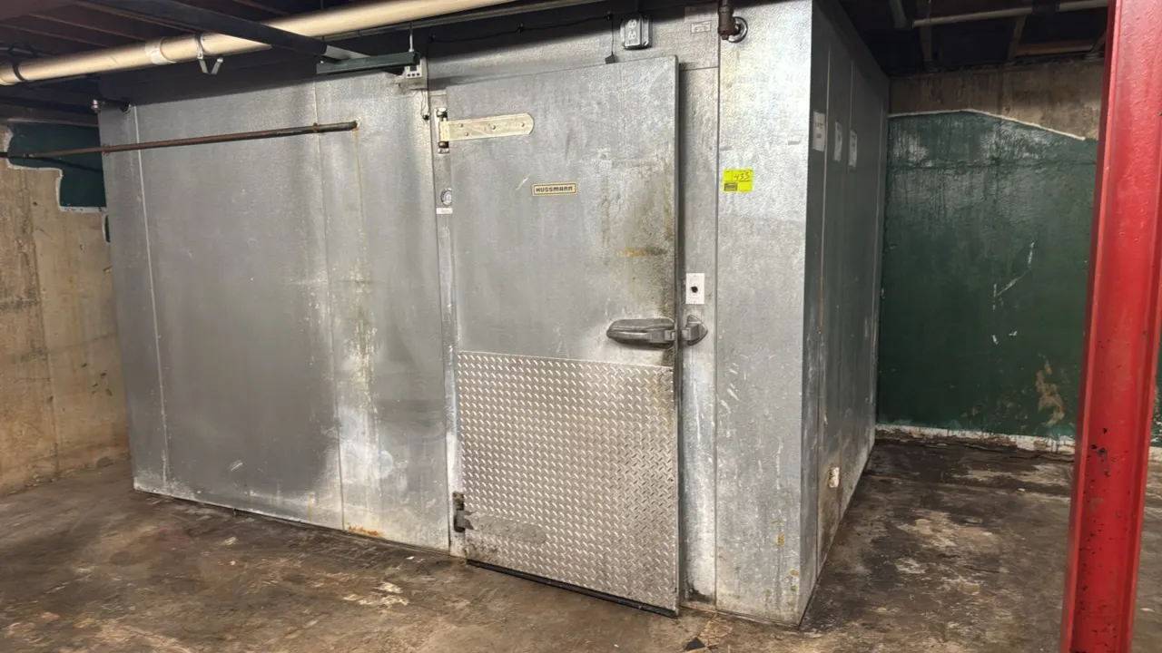 Hussmann walk-in cooler. Features insulated foam panel construction, hinged entry door with diamond plate kickplate, Hussmann 2-fan evaporator coil, a