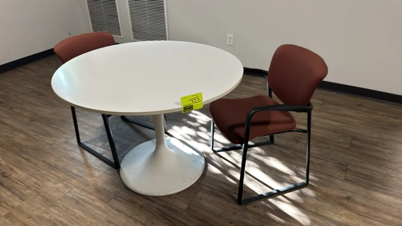 Laminate table with (2) guest chairs. Includes 42" round table featuring a white laminate top mounted on a flared pedestal base, and (2) armchairs wit