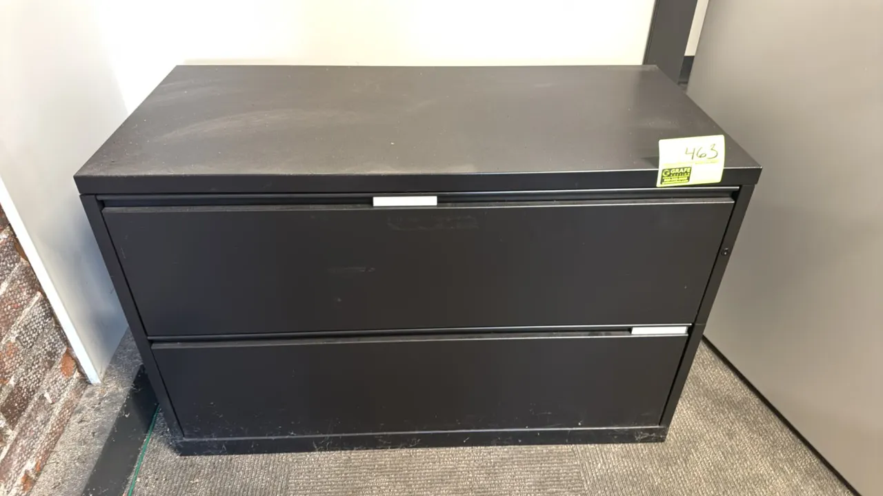 Metal 2-drawer lateral file cabinet. Features black finish, recessed drawer pulls, and integrated label holders. 42"W.