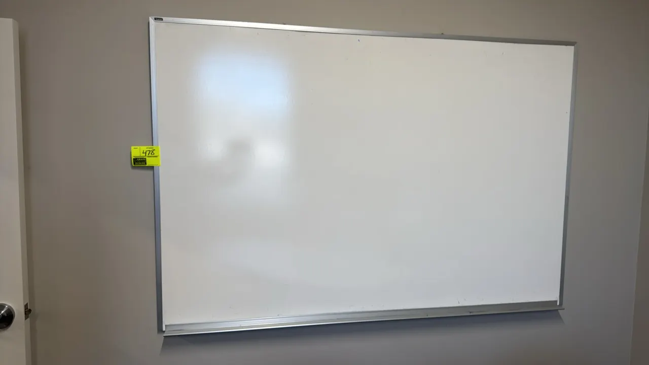 Dry erase whiteboard. Features an aluminum frame and integrated bottom marker tray. 6'W x 4'H. Wall mounted.