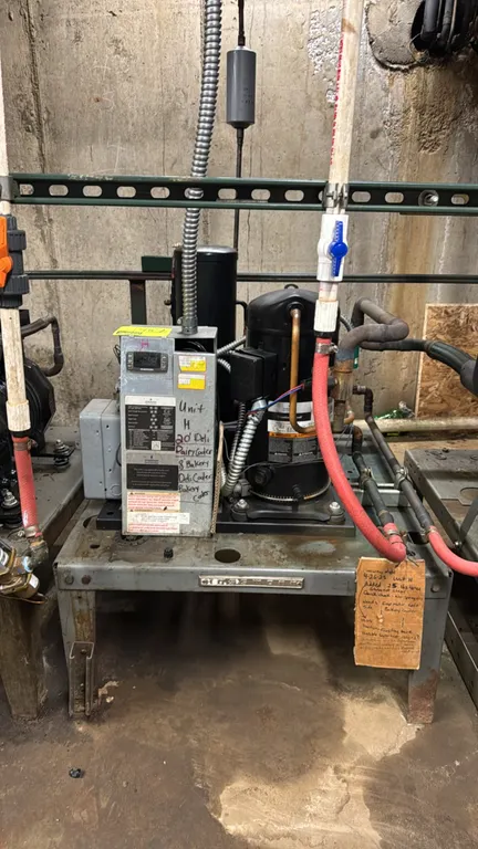 2015 medium-temp compressor rack. Features an Emerson FFWP-050Z-TFC-020 condensing unit (S/N: 15FA0644U) with Copeland Scroll ZS38K4E-TF5-250 compress