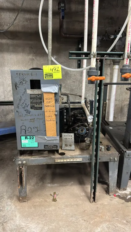 Hussmann medium-temp compressor rack. Features a 1996 1 HP Emerson Copeland compressor, liquid receiver, and Hussmann Uni-Panel control box. Configure