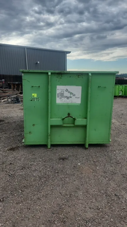 20-yard hooklift dumpster container (Container #2015). Features rear double barn doors with dual latches, front lift hook with 36" hook height, and bo