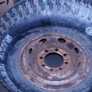 2.85 X 75 X 16 USED TIRE ON AN 8 HOLE DODGE RIM