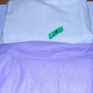 UNCLAIMED STORAGE:  PURPLE FLEECE (APPROX. 60" X 30") & WHITE FLEECE (APPROX. 60" X 30")