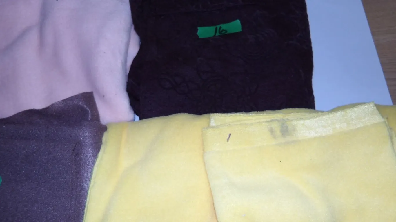 UNCLAIMED STORAGE: 4 BUNDLES OF FABRIC