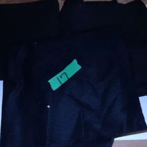 UNCLAIMED STORAGE:  2 BUNDLES BLACK FABRIC