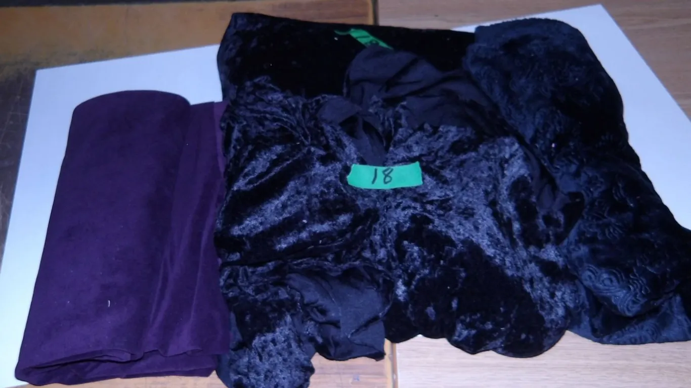 UNCLAIMED STORAGE: 1 BUNDLE PURPLE FABRIC & 3 BUNDLES BLACK FABRIC
