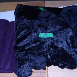 UNCLAIMED STORAGE:  1 BUNDLE PURPLE FABRIC & 3 BUNDLES BLACK FABRIC