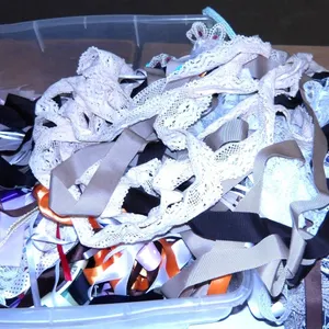UNCLAIMED STORAGE:  RUBBERMAID TOTE C/W LACE & RIBBON