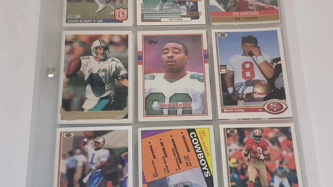 9 SHEETS (53 CARDS) NFL STAR AND ROOKIE CARDS (MONTANA, AIKMAN +)