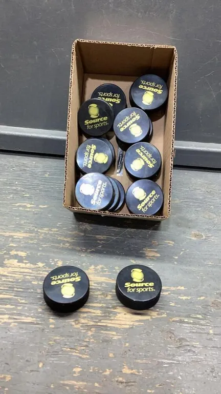 BOX WITH 17 HOCKEY PUCKS “SOURCE FOR SPORTS”