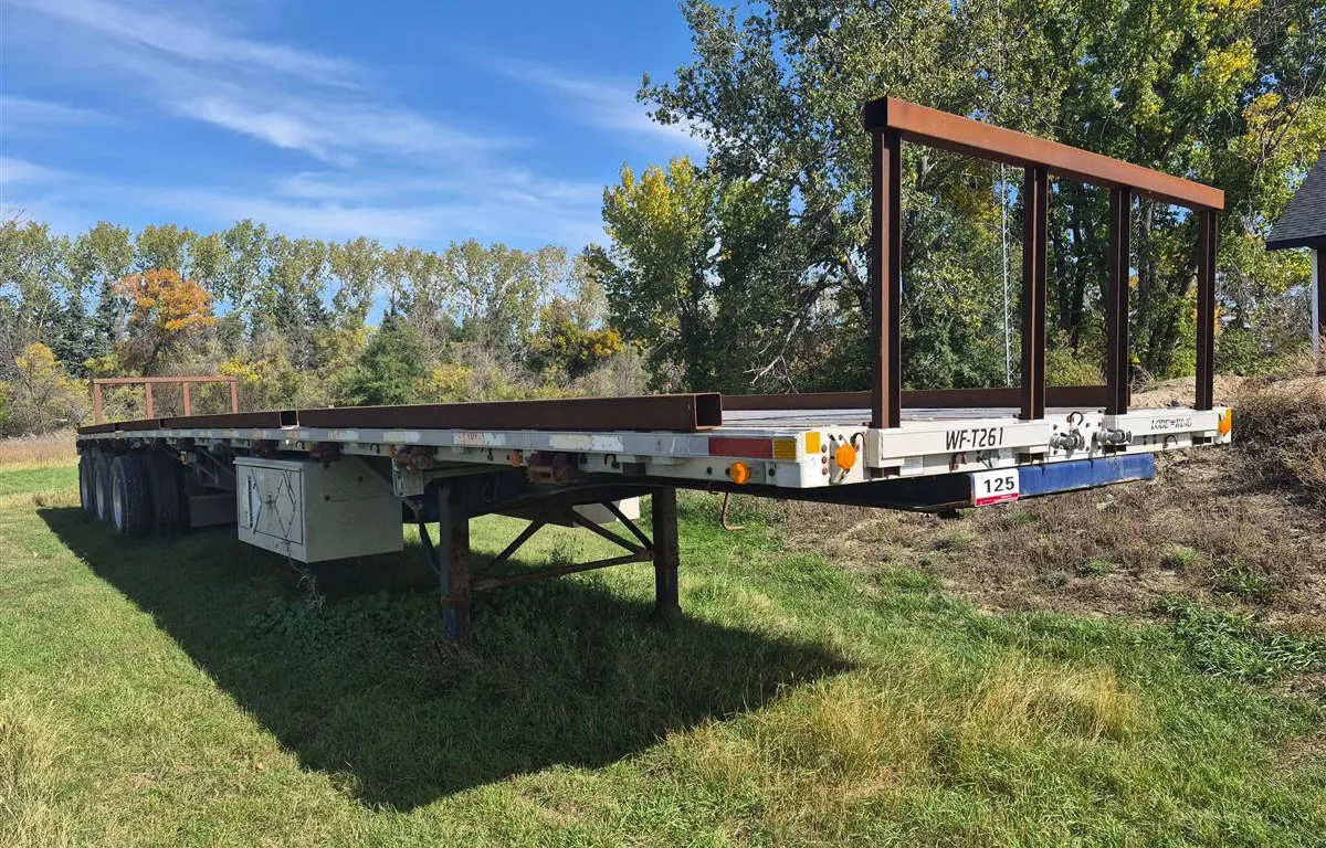 2001 Lode King Tri/A Flat Deck Trailer w/ Hay Racks
UNRESERVED