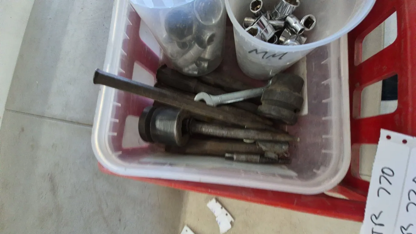 Assorted Sockets, Wrenches, Punches, and Other Tools in Red Crate and Plastic Containers