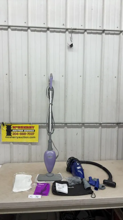 Shark Steam Mop with instructions and extra mop head, and Black and Decker Flex Vac Handheld