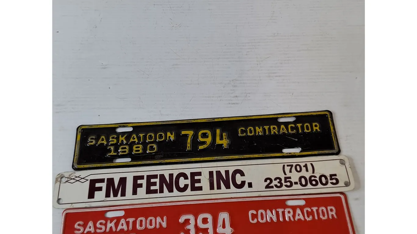 (2) Saskatoon Contractor License Plate Addons 1979/80, FM Fence Advertisement