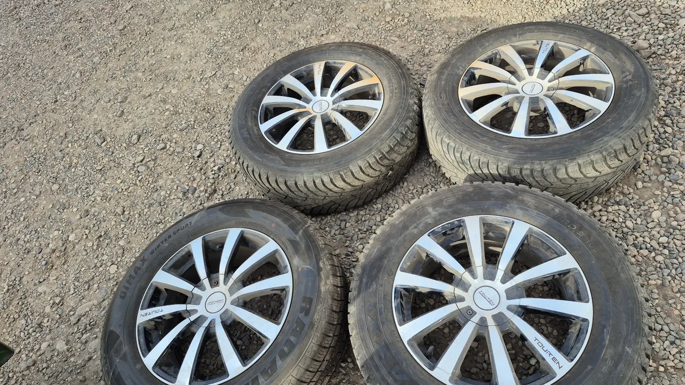 4 - 235/65R17 Winter Tires On Rims