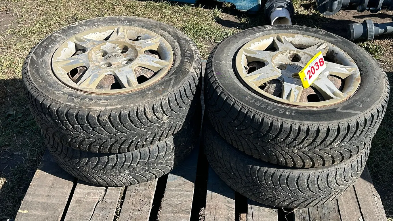 (4) RoadX Winter Tires 185/65R14 4-bolt Steel Rims 5x100 Bolt Pattern from a Kia Spectra