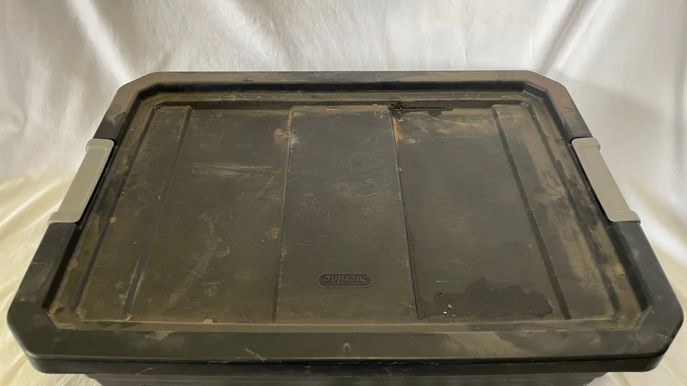 Black Plastic Tote with Tools and Cords