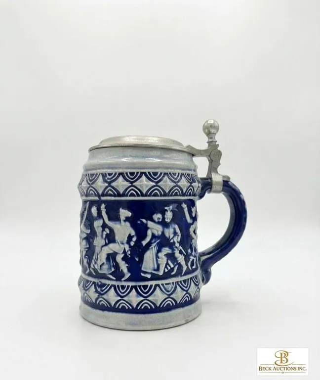 German Stoneware Beer Stein with Pewter Lid and Relief Decoration