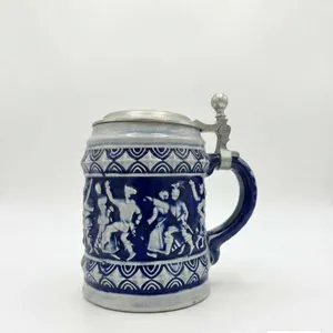 German Stoneware Beer Stein with Pewter Lid and Relief Decoration