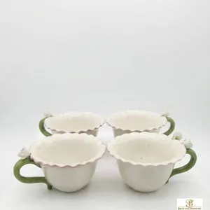 4 Ceramic Flower-Themed Cups with Green Handles