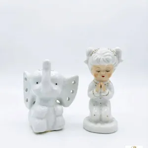 Porcelain Praying Girl Figurine and Elephant Figure Pair