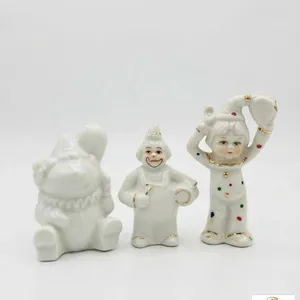 Porcelain Clown Figurines Trio with Gold Trim and Polka Dots