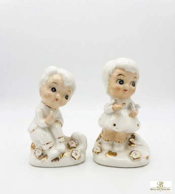 Porcelain Boy and Girl Figurines with Gold Accents