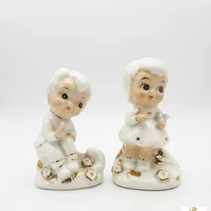 Porcelain Boy and Girl Figurines with Gold Accents