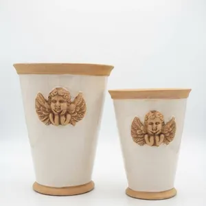 Four Ceramic Planters with Cherub Relief Decoration