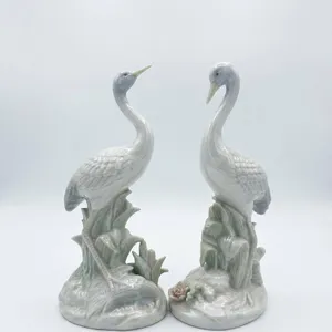 Porcelain Crane Figurines with Floral Bases