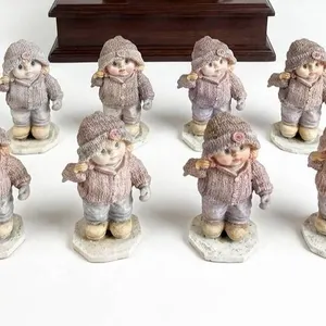 8 Porcelain Girl Figurines in Winter Clothing