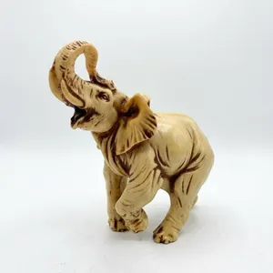 Carved Resin Elephant Figurine with Upturned Trunk