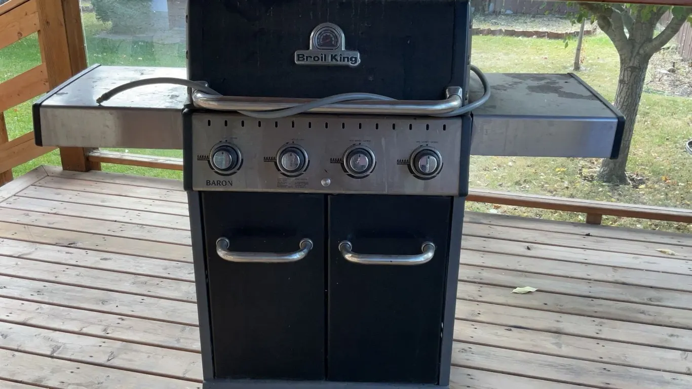 Outdoor Garden Lot with Broil King Gas Barbeque, Planter Boxes, Green Table, Tools and Hose