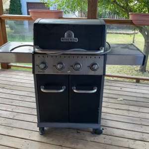 Outdoor Garden Lot with Broil King Gas Barbeque, Planter Boxes, Green Table, Tools and Hose