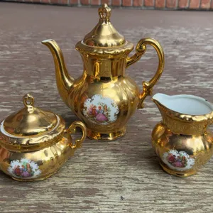 Gold Gilt Japanese Porcelain Tea Set: Teapot, Sugar Bowl, Creamer, Courting Scene