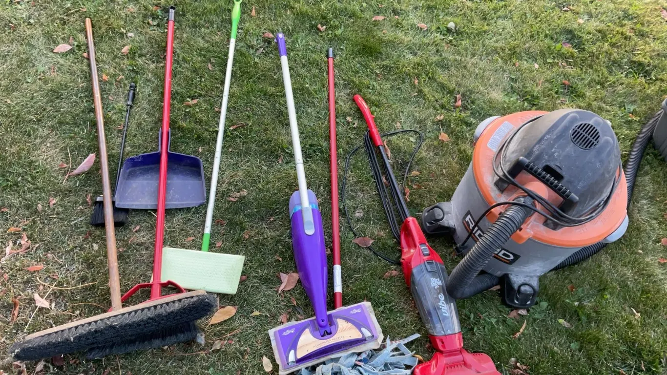 Cleaning Lot With Shop Vac, Dirt Devil, Brooms, Mop, Cat Carrier, and Small Table