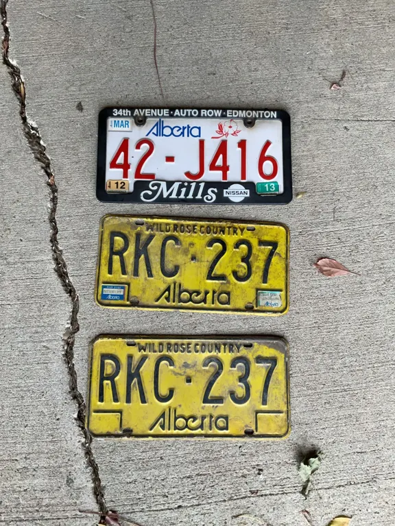Three Alberta License Plates Including 42-J416 and Two RKC-237 Plates